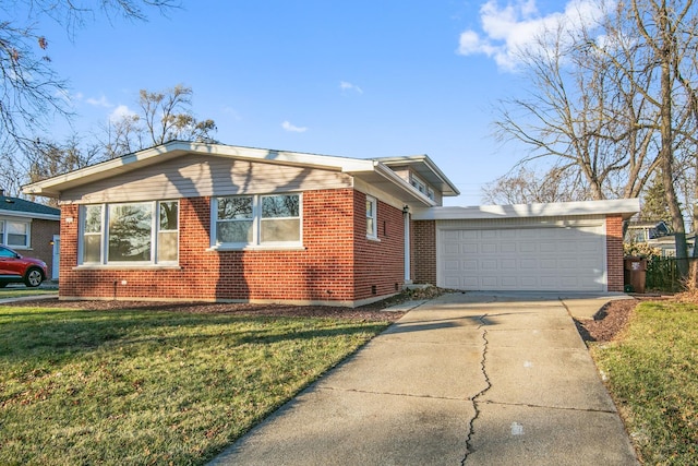 view of front facade with a front yard and a garage