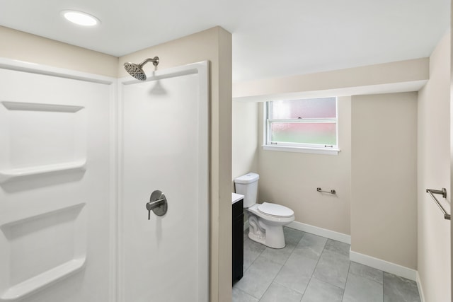 bathroom with tile patterned flooring, vanity, toilet, and walk in shower