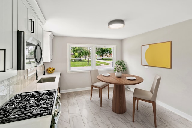 dining space featuring sink