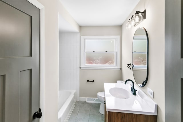 bathroom with tile patterned floors, vanity, and toilet