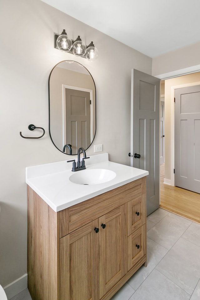 bathroom with tile patterned floors and vanity