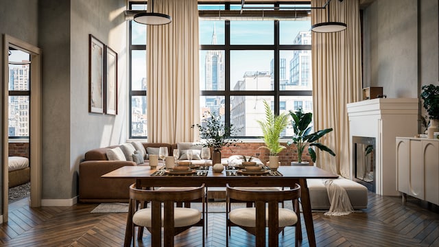 dining area featuring a wealth of natural light, floor to ceiling windows, and parquet flooring