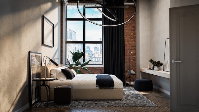 bedroom featuring parquet flooring and brick wall