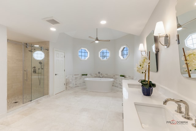 bathroom featuring ceiling fan, vanity, independent shower and bath, and tile walls