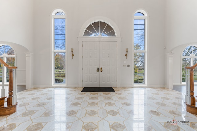 entryway with a healthy amount of sunlight and a high ceiling