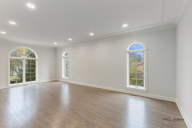 unfurnished room featuring hardwood / wood-style flooring and ornamental molding