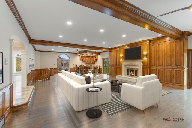 living room with hardwood / wood-style floors, ornamental molding, decorative columns, and beamed ceiling