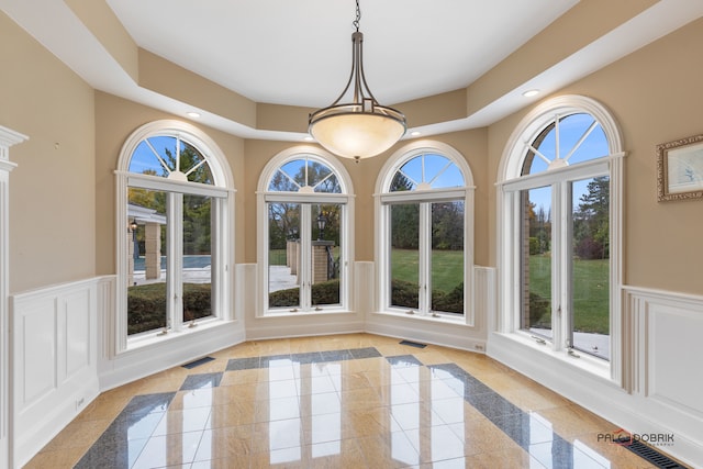 unfurnished dining area featuring a healthy amount of sunlight