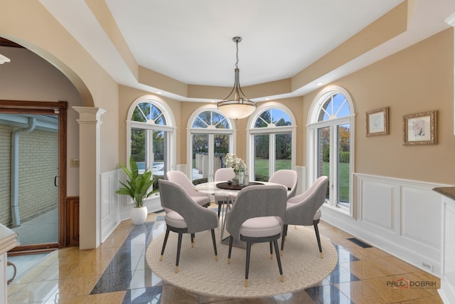 dining area featuring a tray ceiling