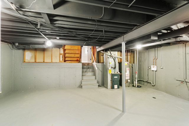 basement featuring water heater and heating unit