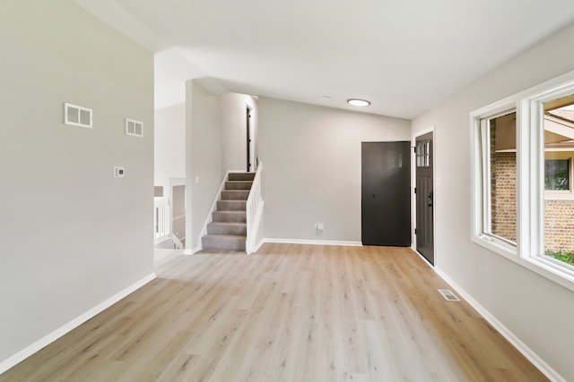 spare room with light hardwood / wood-style floors