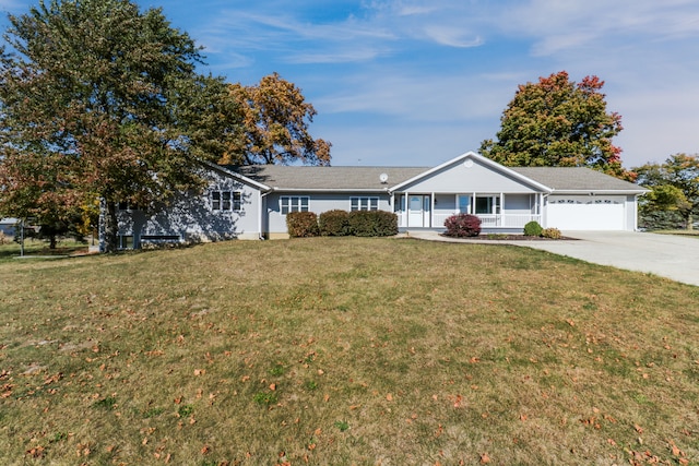 single story home featuring a garage and a front lawn