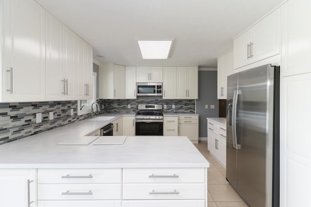 15054 E 2500 N Rd, Hudson, IL 61748 - kitchen featuring appliances with stainless steel finishes, a sink, decorative backsplash, light countertops, and light tile patterned floors