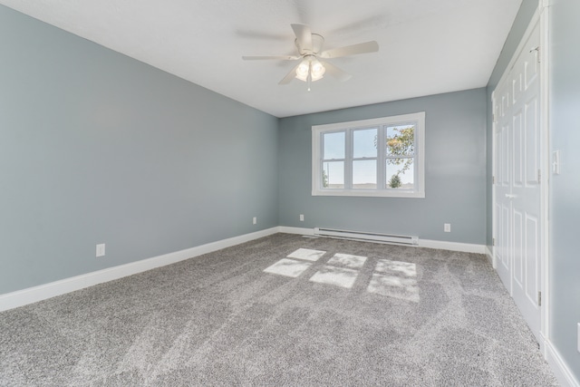 unfurnished bedroom with a baseboard heating unit, carpet flooring, and ceiling fan