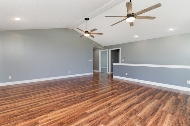 spare room featuring ceiling fan, vaulted ceiling with beams, and dark hardwood / wood-style flooring