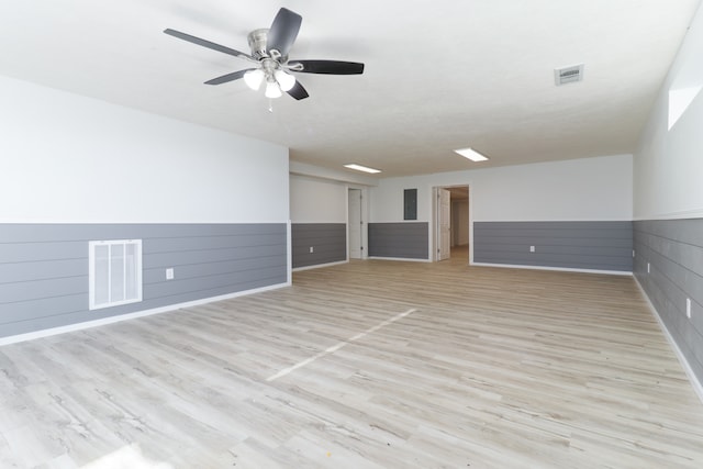 unfurnished room with light wood-type flooring and ceiling fan