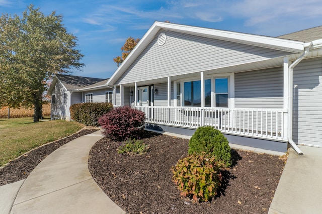 single story home featuring covered porch