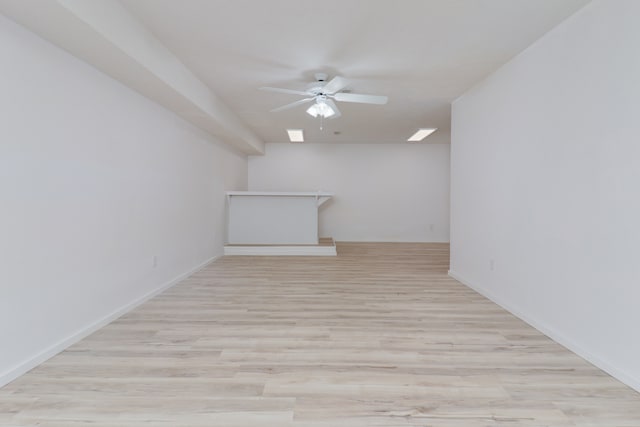 empty room featuring light hardwood / wood-style floors and ceiling fan