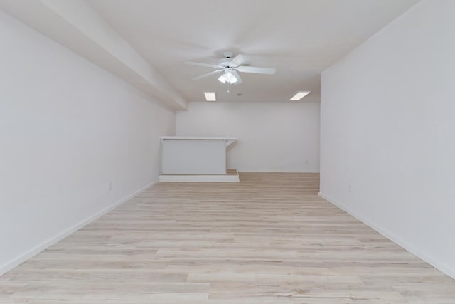 15054 E 2500 N Rd, Hudson, IL 61748 - empty room featuring a ceiling fan, light wood-style flooring, and baseboards