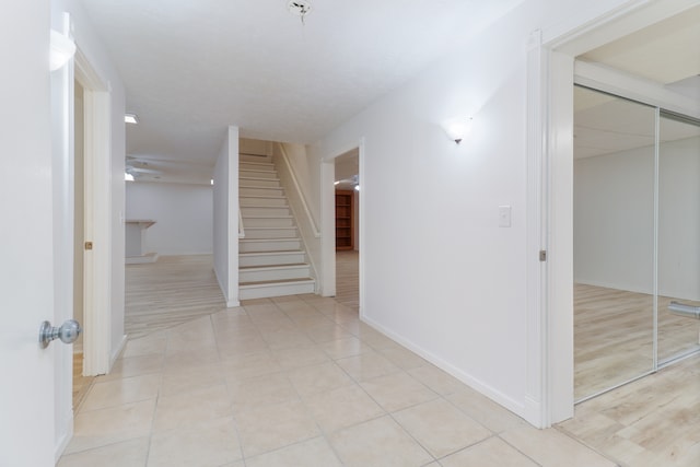 hallway with light tile patterned floors