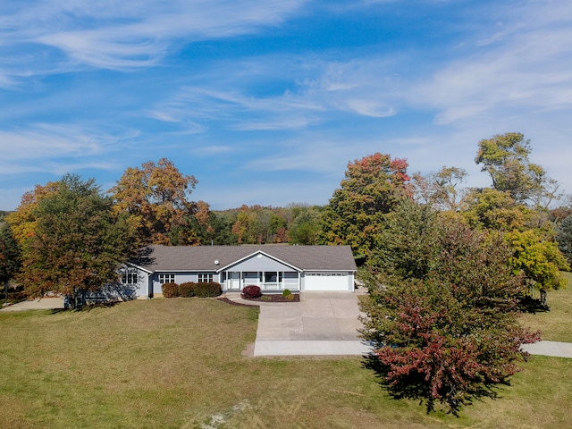 single story home featuring a front yard and a garage