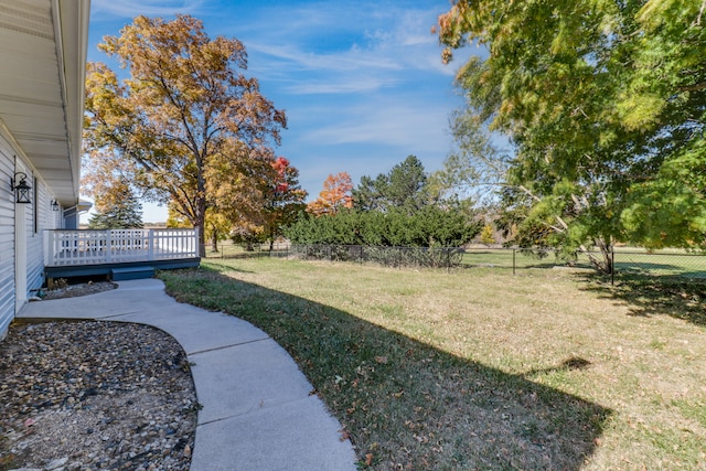 view of yard featuring a wooden deck