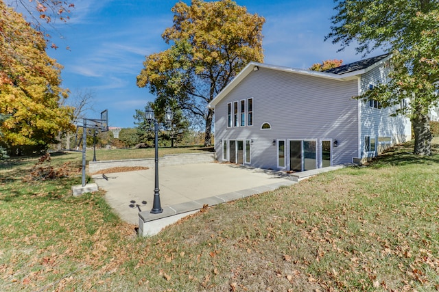 view of home's exterior featuring a yard and a patio area