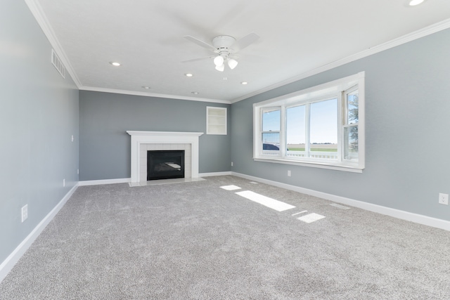 unfurnished living room featuring carpet, ceiling fan, and ornamental molding