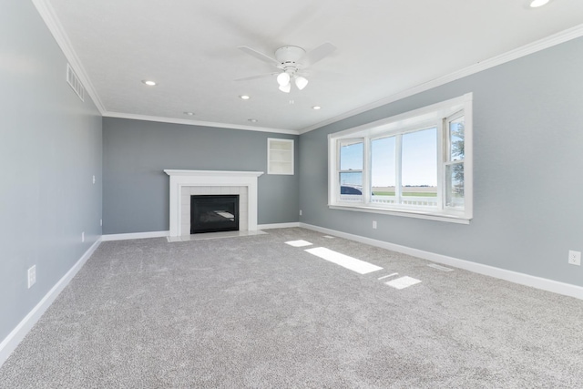15054 E 2500 N Rd, Hudson, IL 61748 - unfurnished living room with a ceiling fan, carpet flooring, crown molding, baseboards, and a tile fireplace