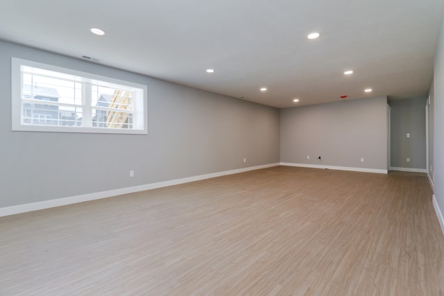 spare room featuring light hardwood / wood-style flooring