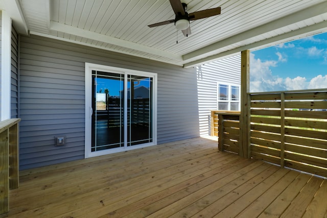 wooden deck featuring ceiling fan