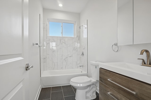 full bathroom with vanity, tiled shower / bath combo, toilet, and tile patterned floors