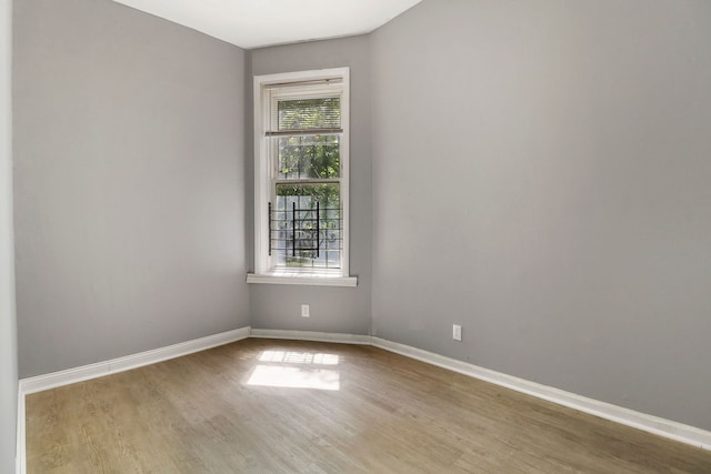 spare room with light hardwood / wood-style floors