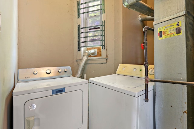 laundry room featuring separate washer and dryer