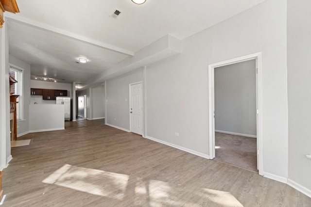 unfurnished living room featuring light hardwood / wood-style floors