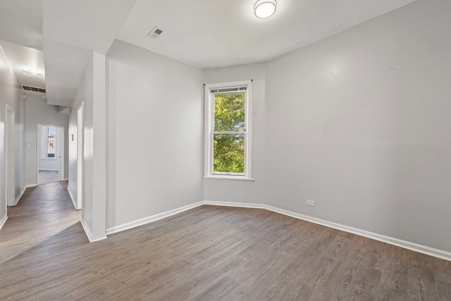 empty room featuring wood-type flooring