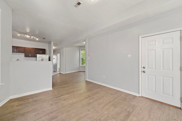 unfurnished living room featuring wood-type flooring