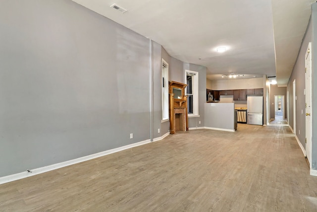 unfurnished living room with light hardwood / wood-style flooring