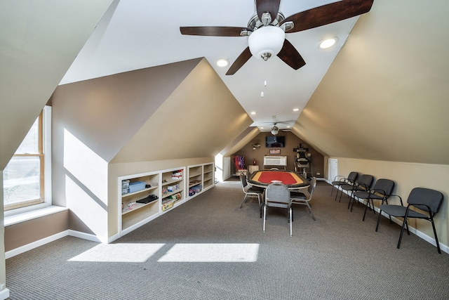 playroom featuring built in features, vaulted ceiling, carpet flooring, and ceiling fan