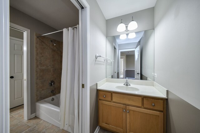 bathroom featuring vanity, tile patterned flooring, and shower / bath combination with curtain