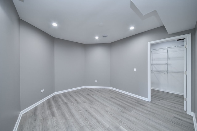 unfurnished room with light hardwood / wood-style flooring