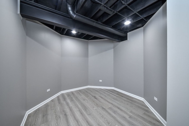 basement featuring wood-type flooring