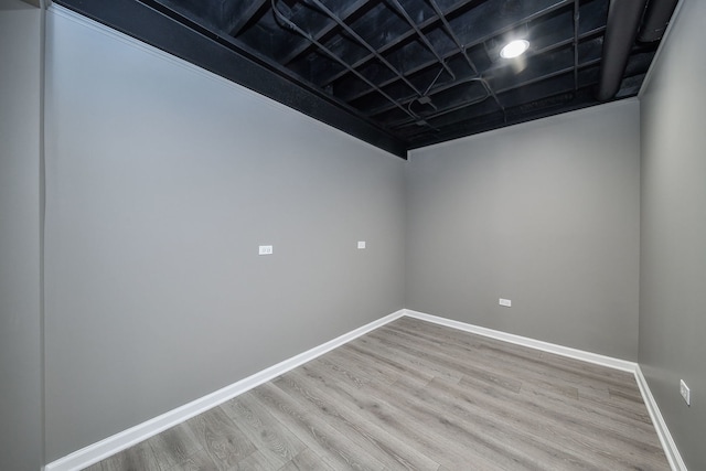 unfurnished room with light hardwood / wood-style flooring