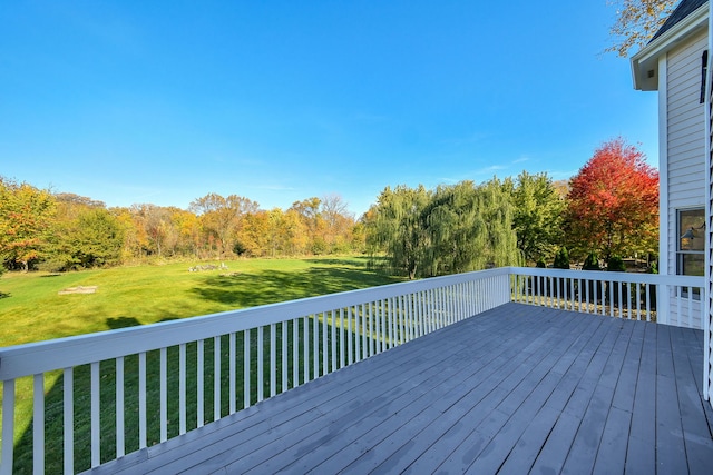 wooden terrace with a yard