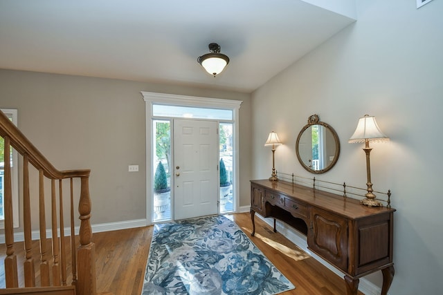 entryway with hardwood / wood-style flooring