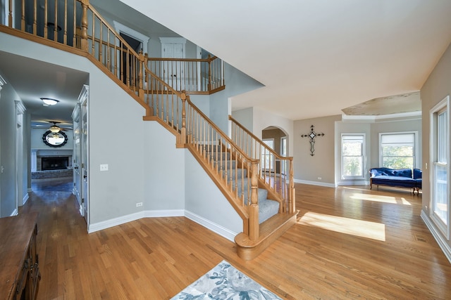 stairs with hardwood / wood-style floors