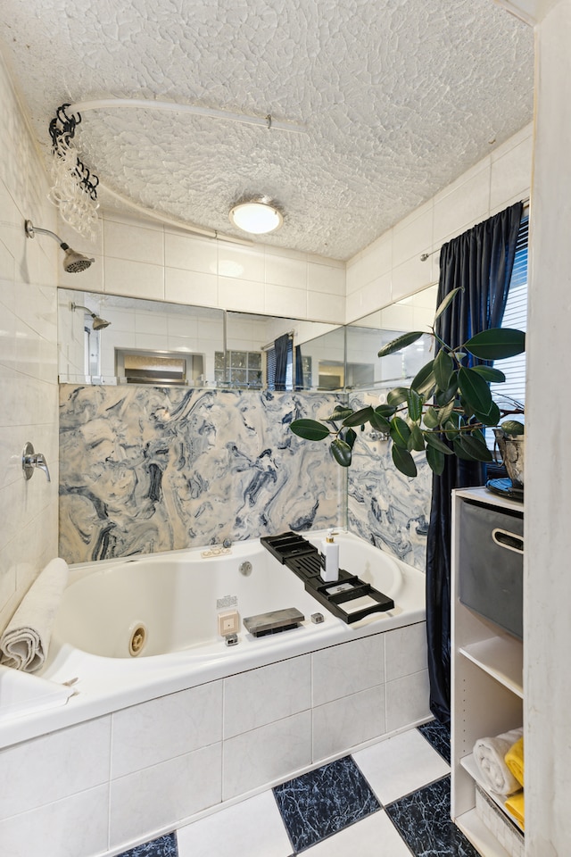 bathroom featuring tile walls and a textured ceiling