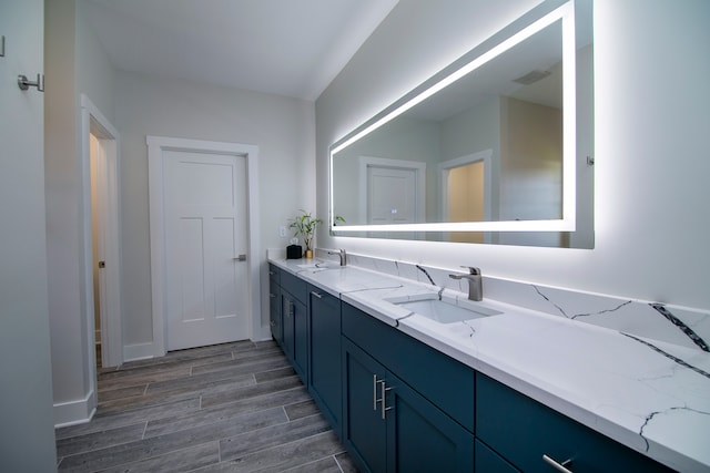 bathroom featuring vanity and wood-type flooring