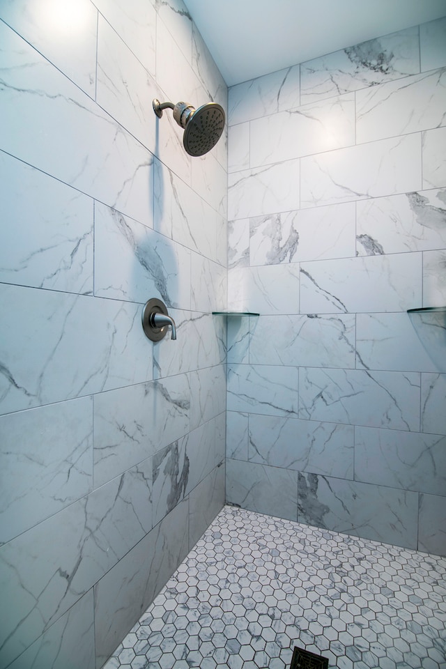 bathroom with tiled shower