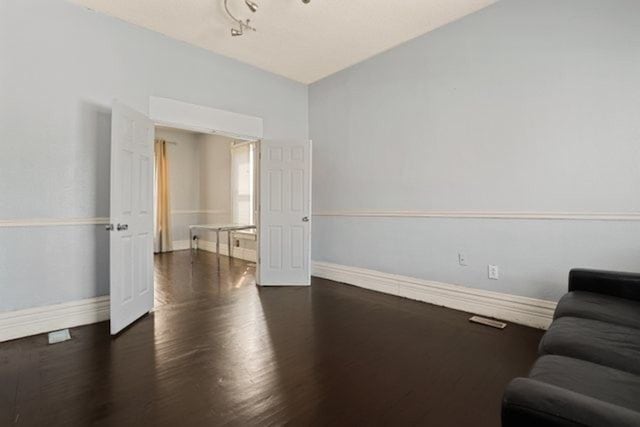 living room featuring dark wood-type flooring